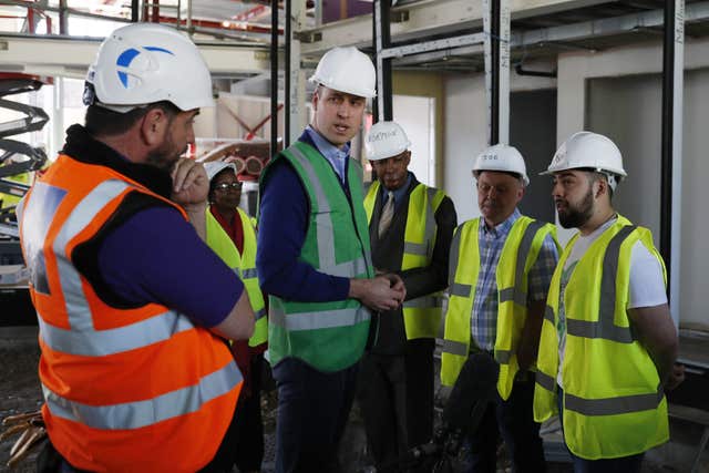 The Duke of Cambridge speaks to Jason Garcia (right) whose cousin Jessica died in the Grenfell fire and presenter Nick Knowles (left) (Adrian Dennis/PA)