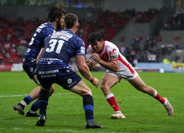Lachlan Coote, right, scored a try and six goals as St Helens beat Wigan 24-6 on Sunday at a rain-lashed Totally Wicked Stadium