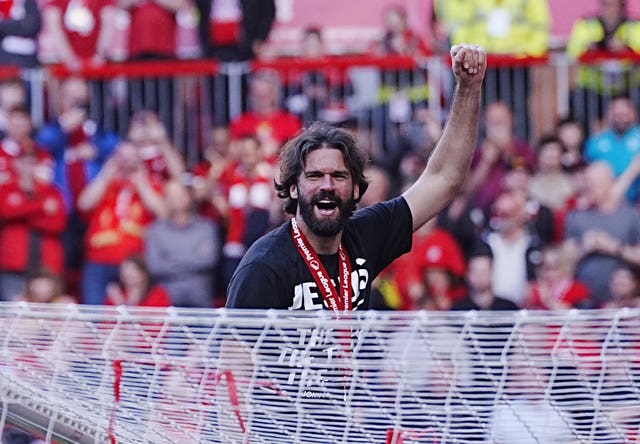 Goalkeeper Alisson Becker celebrates Liverpool's Premier League title success