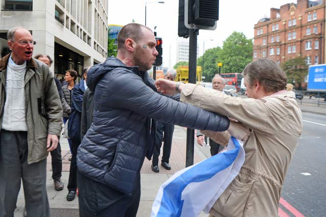 A scuffle ensued outside Westminster Magistrates’ Court (Victoria Jones/PA)