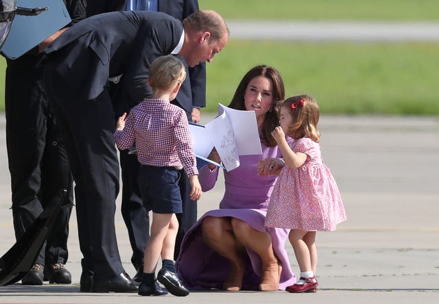 The Duke and Duchess of Cambridge looking after their children Prince George and Princess Charlotte (Jane Barlow/PA)