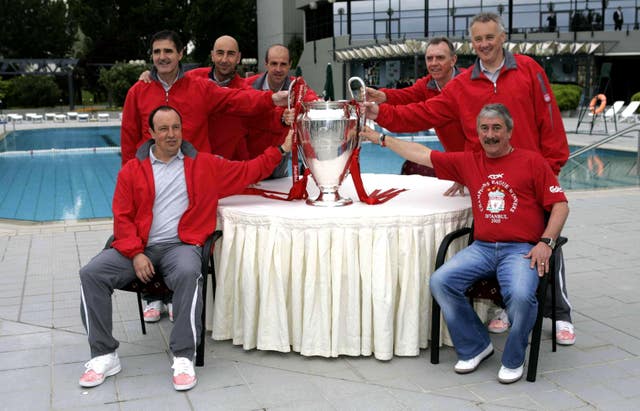 Parry, back right, and Benitez, front left, and former Liverpool chairman David Moores, front right, pose with the Champions League trophy in 2005