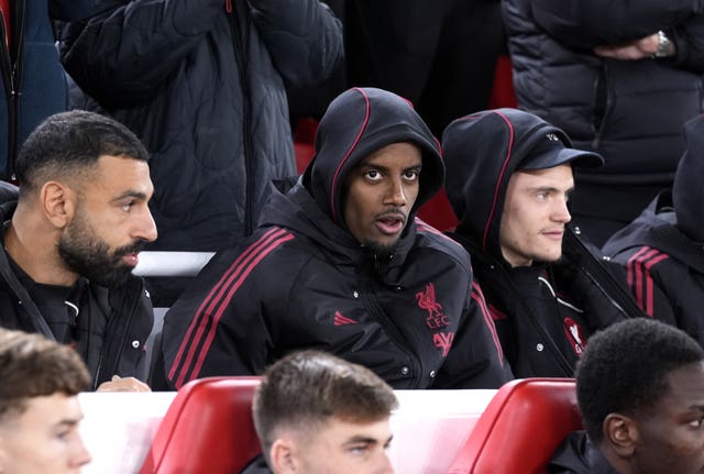 Alexander Isak sat with his hood up