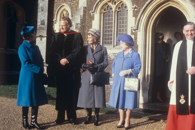 American evangelist Billy Graham (second left) speaking to the Queen, and the Queen Mother, when he preached at Sandringham Parish Church (PA)