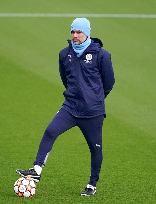 Pep Guardiola tries to play down talk of Manchester City winning the treble