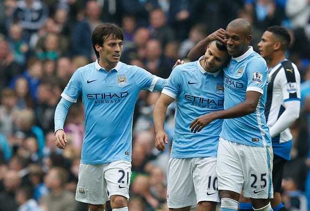 Sergio Aguero (centre) celebrates with his team-mates