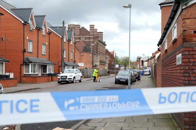 Police at the scene in Ettington Road in Aston (Matthew Cooper/PA)