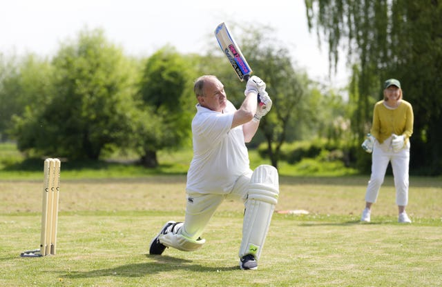 Liberal Democrat Leader Sir Ed Davey playing cricket