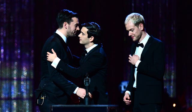 The 1975 accept an award at the Brits