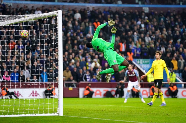 Edouard Mendy is beaten by a header from team-mate Reece James, not pictured