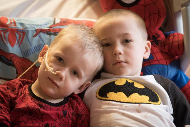 Brothers, four-year-old Ollie (left) and Finley Cripps, six, from Sittingbourne, Kent, at the Royal Marsden hospital in Surrey, after Finley donated his stem cells to his brother (Stefan Rousseau/PA)