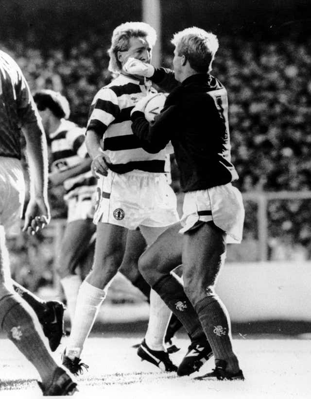 Rangers goalkeeper Chris Woods, right, tangles with Celtic’s Frank McAvennie in the seventh minute of their controversial match at Ibrox Stadium