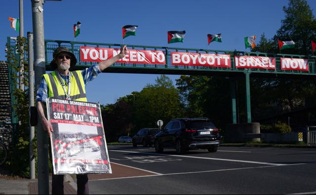 People attend a pro-Palestine protest outside RTE in Dublin