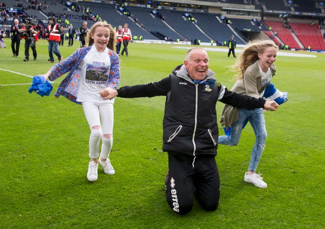Hughes celebrates at Hampden with his daughters