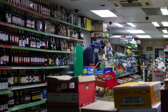 A photo issued by Historic England from its Picturing Lockdown Collection entitled Worker, off licence by Gemma Mancinelli from London