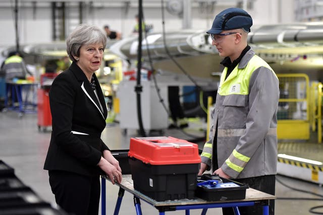 Theresa May during a visit to the Bombardier factory in Belfast (Charles McQuillan/PA)