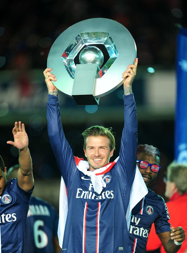 David Beckham celebrates with the Ligue 1 trophy