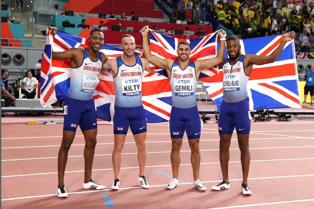 Zharnel Hughes, Richard Kilty, Adam Gemili, and Nethaneel Mitchell-Blake celebrate their medal