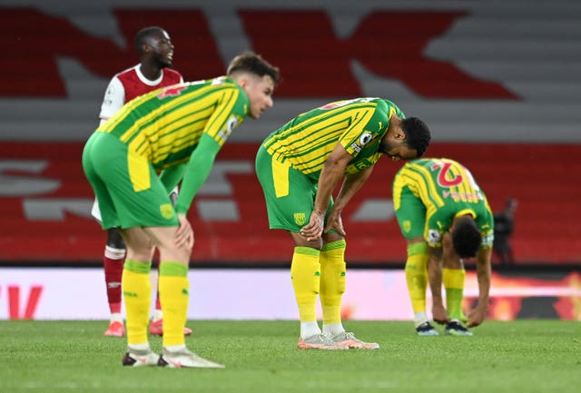 West Bromwich Albion players look dejected after relegation was confirmed