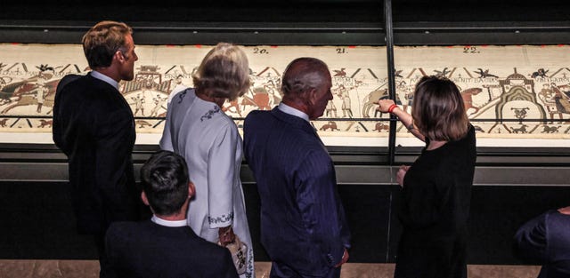 Charles, Camilla and Emmanuel Macron view the Bayeux Tapestry