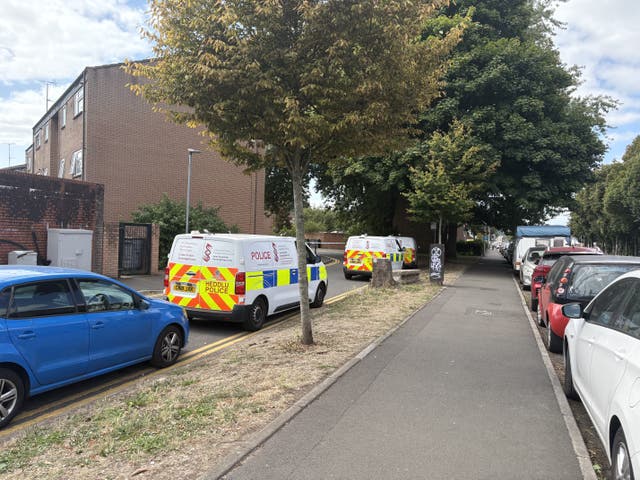 A police van parked on a busy road in Cardiff