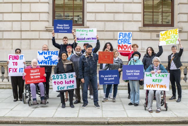A protest by Age UK and other members of the Care Support Alliance outside the Treasury