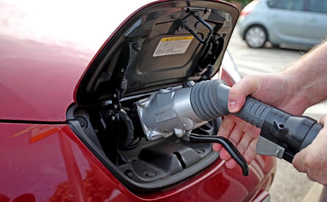 Bringing forward the switch to electric vehicles will be cheaper, the committee says (Peter Byrne/PA)