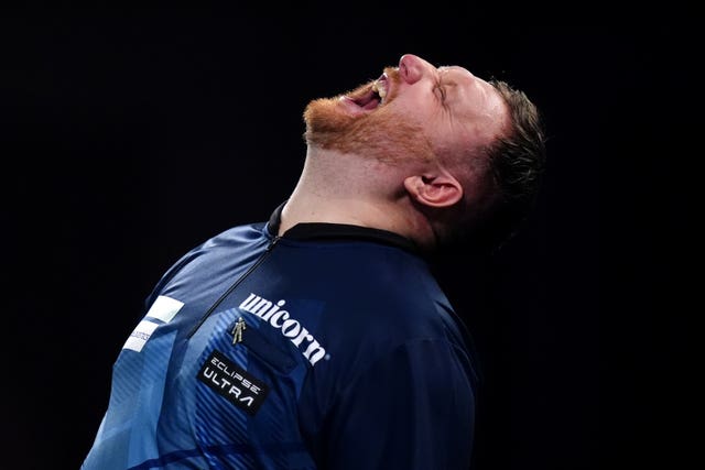 Cameron Menzies reacts during his match at the 2025 World Darts Championship