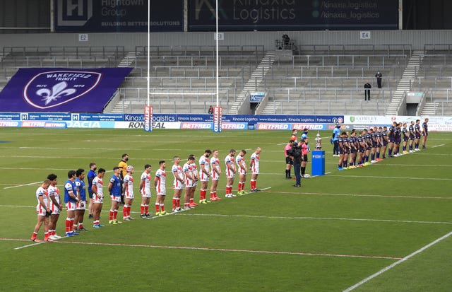 St Helens and Leeds Rhions players stand for a two minute silence before kick off 