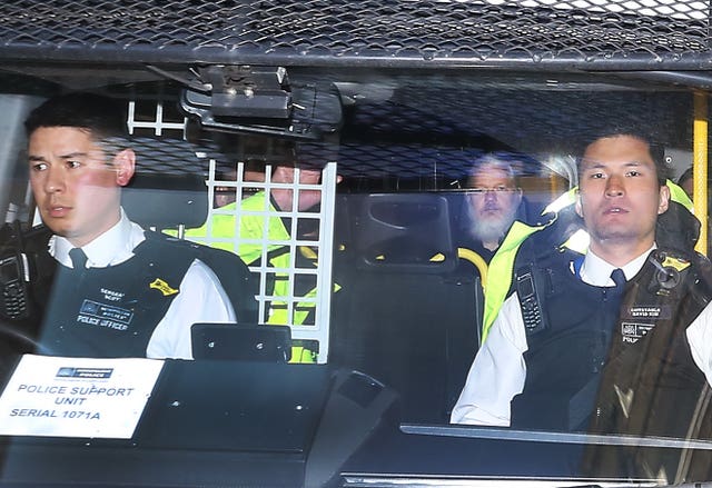 Julian Assange being arrested