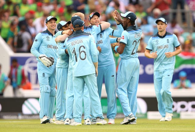 Ben Stokes is mobbed by his England team-mates after his wonder catch (Nigel French/PA)