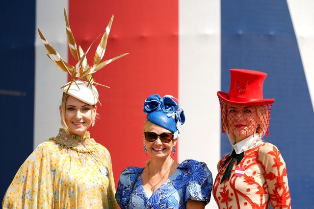Racegoers pose for photographs at Royal Ascot 