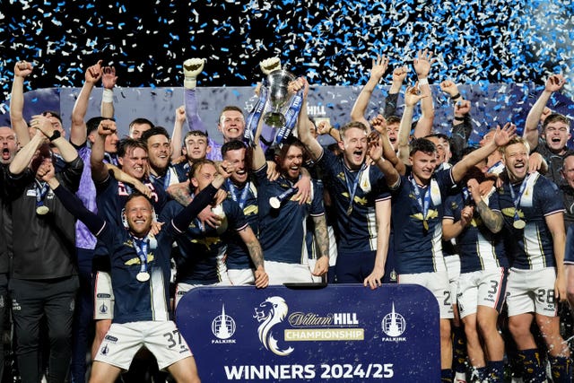 The Falkirk squad cheer as they lift the Championship trophy