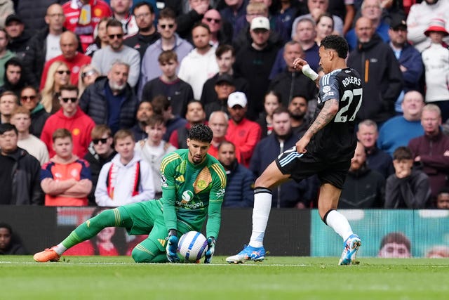 Aston Villa’s Morgan Rogers, right, kicks the ball away from Manchester United goalkeeper Altay Bayindir before scoring a goal that was disallowed