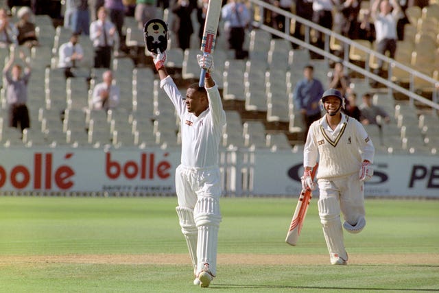 Brian Lara celebrates his record haul