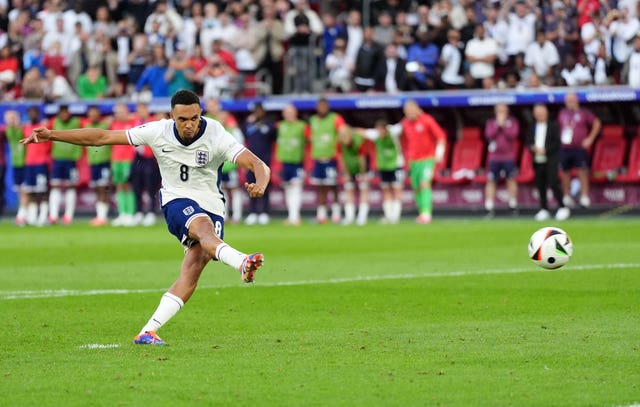 England’s Trent Alexander-Arnold scores the winning penalty in the shoot-out victory against Switzerland