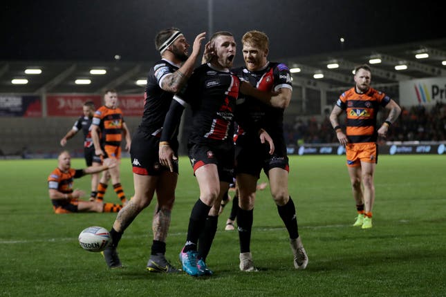 Jackson Hastings celebrates his try