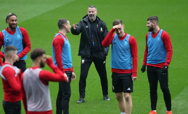 Ryan Giggs, centre, shouts instructions to his Wales squad in a training session