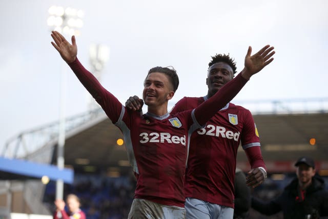 Aston Villa players Jack Grealish (centre) and Tammy Abraham (right) (PA)