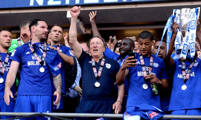 Neil Warnock celebrates winning promotion to the Premier League 