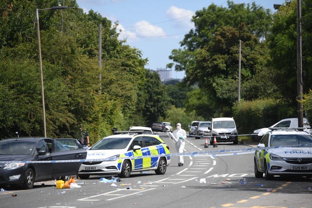 Forensic officers at the scene of a shooting in Roydon, Harlow