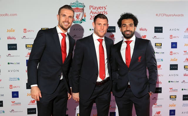 Liverpool’s Jordan Henderson (left), James Milner and Mohamed Salah (right)