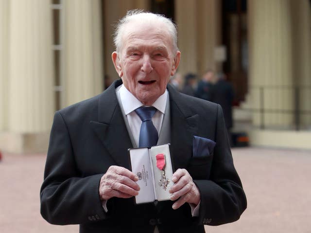 Squadron Leader George 'Johnny' Johnson after he was awarded an MBE by Queen Elizabeth II at an Investiture ceremony at Buckingham Palace, London (Steve Parsons/PA)