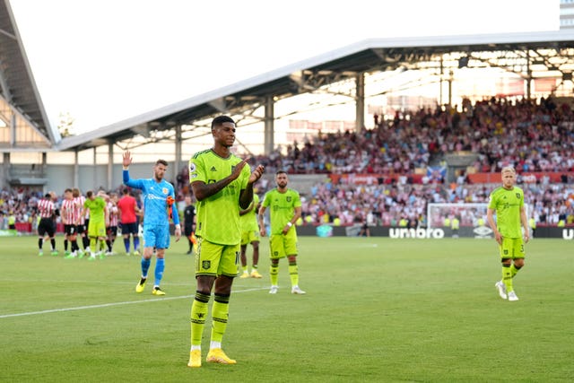 Manchester United’s Marcus Rashford applauds the fans after defeat at Brentford