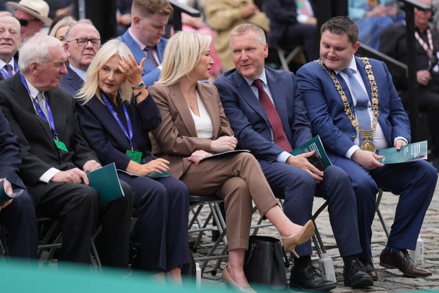 Former taoiseach Bertie Ahern, left, and Sinn Féin vice president and Stormont First Minister Michelle O’Neill, centre, were among the crowd