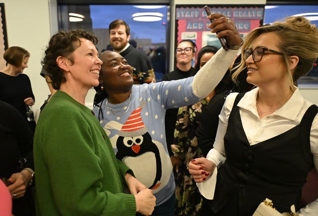 Actress Olivia Colman, left, meeting with young people to discuss issues surrounding violence against women and girls