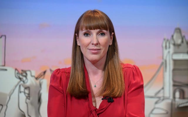 Angela Rayner smiling in a TV studio, wearing a red blazer