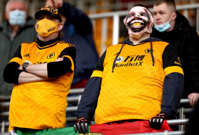 Football fans will need to wear face coverings in indoor areas within stadiums and on public transport on the way to matches