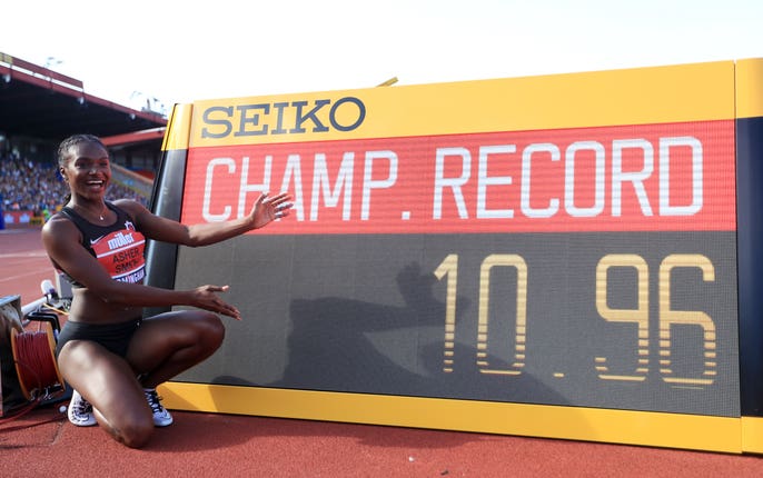 Dina Asher-Smith celebrates