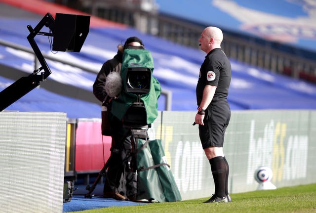 Simon Hooper checks the pitchside monitor 